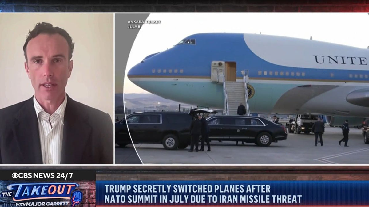 Elliot Ackerman discusses an Iranian threat to President Trump alongside footage of Air Force One in Ankara, Turkey, during a CBS News segment.